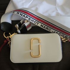 Marc Jacobs Snapshot Nwot Red, Blue And White $300 Modern White Shoulder Bag With Logo Strap, Luxury White Shoulder Bag With Logo Strap, Chic White Shoulder Bag With Logo Strap, White Crossbody Bag With Logo Strap, Elegant White Bags With Logo Strap, White Shoulder Bag With Logo Strap For Travel, Chic White Bag With Logo Strap, White Bag With Logo Strap For Everyday Use, White Bag With Logo Strap For Shopping