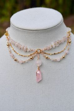 One of a kind Rose Quartz choker necklace. Made with 14k gold elements that will last. Message me for custom sizing, we are size inclusive! Raw Gemstone Jewelry Necklace, Rose Quartz Choker, Fairy Choker Necklaces, Jewelry Making Aesthetic, Witch Barbie, Ballroom Extravaganza, Fairy Choker, Gemstone Necklace Diy, Diy Necklace Patterns