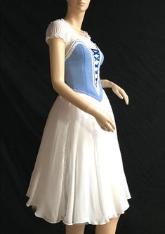 a mannequin dressed in a blue and white dress