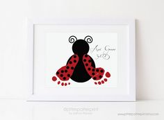 a pink and black ladybug with polka dots on it's legs, sitting in front of a white frame