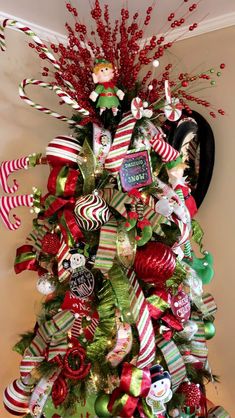 a christmas tree decorated with candy canes and ornaments