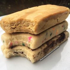 three ice cream bars stacked on top of each other with colorful sprinkles