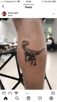 a person with a tattoo on their leg that has a t - rex in it