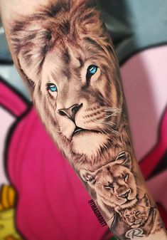 a man with a lion tattoo on his arm