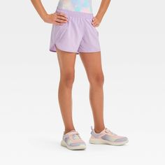 Why we're ALL IN: High-rise run shorts crafted from lightweight recycled polyester fabric offer your child comfort during a range of outdoor activities and sports. The shorts feature a full elastic waistband to help them find the perfect fit. The above-knee length and dolphin hem complete the cool, sporty look. All in Motion™: Made for every move, priced for every day. Rise And Run, Run Shorts, Recycled Polyester Fabric, All In Motion, Fabric Tape, Kids Outfits Girls, Sporty Look, Athletic Fits, Bottom Clothes