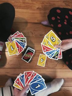 A fun game of Uno at a party with friends Uno Game Night Aesthetic, Card Game Night Aesthetic, Board Game Astethic, Uno With Friends Aesthetic, Card Games With Friends, Friends Playing Board Games Aesthetic, Uno Game Aesthetic, Playing Uno Aesthetic, Game Night Aesthetic Friends