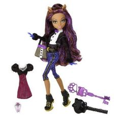 a doll with purple hair holding a purse next to keys and keychains on a white background