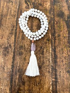 108 Mala Necklace | Mala with White Jade Beads, Brass Guru Bead, Amethyst Pendant, and White Tassel 8mm White Jade Beads Brass African Bead Handmade Tassel Hand Knotted Buddha Pendant Necklace, Amethyst Necklace Pendant, White Tassel, Buddha Pendant, White Jade, Mala Necklace, African Beads, Onyx Bead, Amethyst Beads