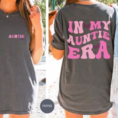 "In My Auntie Era Shirt, Auntie Shirt, Aunt Shirt, Gift for Aunts, Favorite Aunt Shirt, Aunt Gift from Niece, Cool Aunt Shirt, shirt for Aunt I! Welcome to my store, It's really nice to see you here. Good news! 🎉 You're one step closer to touch somebody's life who you never met and make it's dreams come true! This is a real small business with high hopes and irrepressible goals. --- Elevate your Auntie Era style with our trendy collection of Auntie Era Tees, Sweatshirts, and Hoodies. These unique designs are perfect for the coolest aunts out there. Embrace the \"Aunt Era\" with our retro-inspired shirts and sweatshirts that capture the essence of this special time in your life. Whether you're announcing your pregnancy or celebrating your promotion to aunt, we have the perfect custom aunt Casual Shirt With Custom Print For Mother's Day, In My Auntie Era Shirt, Relaxed Fit Shirt With Name Print For Summer, Relaxed Fit Summer Shirt With Name Print, Funny Print Short Sleeve Shirt For Mother's Day, Cute Relaxed Fit Shirt With Letter Print, Casual Shirt With Name Print For Mother's Day, Casual Shirt With Funny Print For Mother's Day, Cute Relaxed Fit Shirt With Custom Print