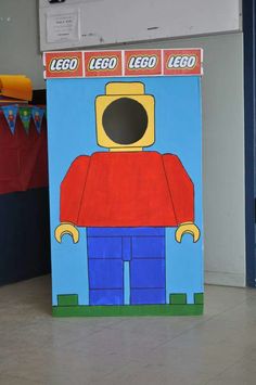 a cardboard box that has a lego man on it