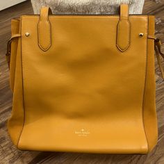 Brand New Kate Spade Purse Large Tote Bag Suade Mixed Material Mustard Yellow In Color Able To Cinch The Sides For A More Narrow Bag Or Leave Open Elegant Yellow Shoulder Bag With Double Handle, Elegant Yellow Tote Shoulder Bag, Formal Yellow Shoulder Bag With Double Handle, Formal Yellow Shoulder Bag With Removable Pouch, Elegant Yellow Bag For Work, Elegant Yellow Workwear Bag, Classic Yellow Shoulder Bag With Handles, Classic Yellow Shoulder Bag, Yellow Leather Bag For Work