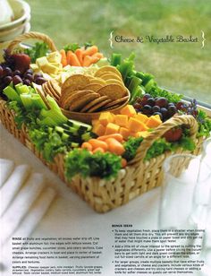 a basket filled with fruit and vegetables on top of a table