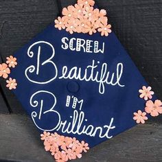 a blue graduation cap that says screen beautiful by brilliant on the front with flowers around it