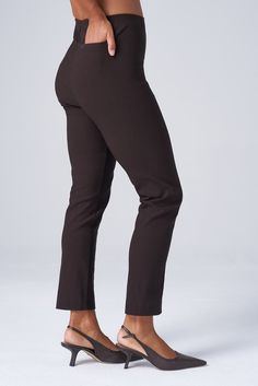 The slim, ankle-length version of the Original Magic Pant—the iconic piece that started it all. Designed to hug your curves perfectly, these pants blend structure with stretch for effortless all-day style. Whether dressing up for a presentation or going casual for coffee, meet your versatile go-to from 9 to 5 and beyond. THE DETAILS High-waisted, pull-on construction with no zippers or side seams offers a sleek, flattering silhouette. Perfect blend of structure and stretch holds you in all the r Fitted Ankle-length Pants With Welt Pockets, Slim Fit Ankle-length Dress Pants With Welt Pockets, Non-stretch Ankle-length Black Pants, Black Stretch Ankle-length Dress Pants, Black Ankle-length Pants With 4-way Stretch, 9 To 5, Dressing Up, Ankle Pants, Work Pants