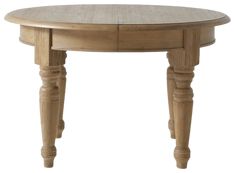 a round wooden table with two drawers on one side and an oval shaped drawer on the other