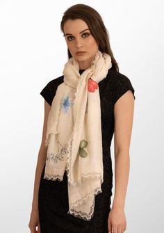 Wrap yourself in luxury with this ivory scarf crafted from a very fine cashmere and adorned with a stunning hand-painted Prime design. The subtle tonal ivory dainty filigree lace border introduces a whimsical touch, making this scarf a harmonious blend of sophistication and playful charm. Elevate your look with this versatile accessory that seamlessly transitions from casual to refined with a stroke of artistic flair. Elegant Cream Silk Scarf For Spring, Elegant Beige Silk Scarf With Floral Print, Elegant Beige Shawl For Spring, Elegant White Shawl For Spring, Elegant Spring Pashmina Shawl, Lace Border, Elevate Your Look, Ivory Lace, Cashmere Scarf