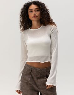 Brixton Sheer Knit Long Sleeve Top. Made From Lightweight, Semi-Transparent Fabric, This Top Offers A Delicate And Airy Feel While Providing Subtle Coverage With Its Long Sleeves. The Sheer Knit Construction Adds Texture And Visual Interest, Making It Ideal For Layering Over Camisoles, Bralettes, Or As An Accent Piece Under Jackets. 67% Viscose, 33% Polyester. Hand Wash. Imported. Model Is Wearing A Size Small. Model Measurements:height: 5'7" Bust: 32cwaist: 24"hips: 35" Crew Neck Cropped Sweater For Layering, Crew Neck Pointelle Knit Cropped Sweater For Layering, Pointelle Knit Cropped Sweater For Layering, Spring Crew Neck Cropped Sweater For Layering, Spring Cropped Crew Neck Sweater For Layering, Crew Neck Cropped Sweater For Spring Layering, Spring Layering Cropped Sweater With Crew Neck, Stretch Long Sleeve Cropped Sweater In Fine Knit, Stretch Cropped Sweater With Long Sleeves In Fine Knit