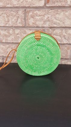 This colorful, handmade green round rattan bag is perfect for any occasion. Its lightweight design and sturdy construction make it a fashionable, yet practical accessory. All our round rattan bags are free shipping worldwide. On average this green rattan bag reaches you within one to five days. Real rattan and straw bags are only made in Bali, Indonesia. Diameter is approx 16 cms. Thickness or width is approx 7 cms. Strap Size: 122 cms. Green round rattan bags have become increasingly popular in Canada Decor, Western Style Interior, Rattan Bags, Rattan Handbags, Cowhide Rugs, Rattan Bag, Straw Bags, Vintage Wicker, Round Bag