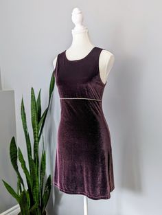 Made in the USA Are you ready to party like it's 1999? This gorgeous, purple party dress with gem beading detail is just delightful. The high neckline and stretchy velvet reminds me of Romy and Michelle's high school reunion. Buy this dress, put it on, then go watch the movie. You can thank me later. Excellent condition, no stains or damage. Tag says size M. Please remember to take your measurements. Vintage sizing may vary greatly! Chest: 32" Waist: 30" Hips: 34" Length: 33" Sweep/Hem: 42" Purple Velvet Fitted Dress, Fitted Purple Velvet Dress, Purple Velvet Dress For Party, Purple Velvet Party Dress, Glamorous Fitted Sleeveless Velvet Dress, Romy And Michelle, Purple Party Dress, Party Like Its 1999, Velvet Party Dress