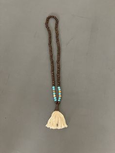 "Prayer beads, mala beads necklace | Vintage Buddha Beaded Tassle Necklace | Meditation Yoga Jewelry | Unisex  Dark wood beads mixed with turquoise dyed howlite and picture jasper beads  Off white thread set in copper  All beads are 8mm  32\" fringe pendant is 3\" long  Check out my shop for more vintage jewelry and clothing! https://sierramadrevintage.etsy.com" Bohemian Wooden Beads Mala For Festival, Bohemian Festival Mala With Wooden Beads, Bohemian Wooden Beads Necklaces For Meditation, Bohemian Wooden Bead Necklaces For Meditation, Spiritual Large Beaded Necklaces For Beach, Bohemian Large Meditation Beads, Wooden Beads Amulet Necklace For Meditation, Meditation Amulet Necklace With Wooden Beads, Bohemian Mala With Colorful Beads For Meditation