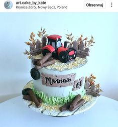 a three tiered cake decorated with farm equipment