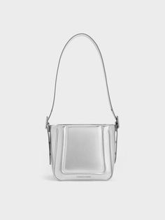 Silver Petra Metallic Boxy Bucket Bag | CHARLES & KEITH Modern Rectangular Box Bag With Detachable Handle, Modern Rectangular Bucket Bag With Adjustable Strap, Modern Bucket Bag With Top Carry Handle For Gift, Modern Silver Box Bag With Top Handle, Modern Square Bucket Bag As Gift, Modern Square Box Bag For Shopping, Silver Rectangular Box Bag With Top Carry Handle, Modern Bucket Shoulder Bag For Gift, Modern Square Bucket Bag