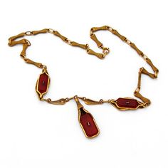 "Magnificent Ornate 10K Yellow Gold Filigree Necklace with inset rectangular Carnelian stones that feature carved Crystal tops with ornate foliate and scroll decorations. c.1910. This wonderful necklace measures 16 1/16\" long with a 1 5/16\" long dangle and weighs 14g. The two smaller Carnelian and carved crystal stones measure 15mm x 7mm, while the larger stone measures 18mm x 10mm. Eb7001" Antique Rectangular Formal Necklace, Vintage Amber Rectangular Jewelry, Antique Bronze Rectangular Jewelry, Antique Rectangular Bronze Jewelry, Vintage Yellow Gold Intaglio Necklace, Vintage Formal Necklace With Rectangular Pendant, Antique Engraved Rectangular Necklace, Antique Rectangular Engraved Necklace, Vintage Rectangular Necklaces For Formal Occasions