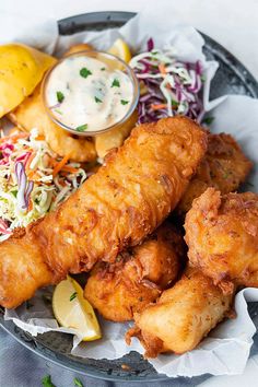 a plate filled with fried chicken and coleslaw