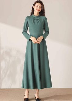 "★★ FEATURES * 30% wool, other fiber, nylon * Polyester lining * Two side pockets * Back zipper closure * Long sleeves * Fitted waist dress * Midi wool dress * Winter wool dress * Perfect for Winter, autumn * Dry clean ★★ The model is 170 cm (5′ 7″) tall with a 80 cm (31.5\") bust, 66 cm (26\") waist. She is wearing the wool dress in size XS. ★★ Bespoke Order Service If you Request other color Request the length Request a sleeve Your height is not between 155 cm- 172 cm Your weight is over 75 kg Green A-line Winter Dress, Fitted Wool Dress With Long Sleeves, Fitted Wool Long Sleeve Dress, Wool Party Dress For Fall, Fall Party Wool Dress, Modest Solid Color Winter Dress, Winter A-line Maxi Dress, Winter Maxi Dress In Solid Color, Solid High Neck Dress For Winter