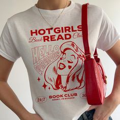 Introducing our sizzling Y2K Baby Tee, revamped with a literary flair as the "Hot Girls Read" edition! This bookish beauty isn't just a tee; it's a celebration of intellect and confidence. Whether you're cozying up with a novel or hitting the town, this Y2K crop top is the ultimate statement piece for bold book lovers. Its snug fit and vibrant colors ensure you stand out in style, while its empowering slogan sparks conversations and ignites passions wherever you venture. Whether gifted to a fell Cake Graphic, Literature Gifts, Y2k Crop Top, Book Shirt, Y2k Baby Tee, Book Shirts, Girl Reading, Baby T Shirts, 90s Style