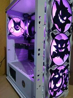 the inside of a computer case decorated with purple and black bats on it's sides