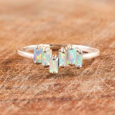 White fire Ethiopian opal statement ring, Wedding ring, ring for women, October birthstone, Rainbow fire opal ring, Multi fire opal ring, 925 Sterling silver ring, Ring for her, Genuine fire opal ring. *Other Similar Jewelry Available Here* https://www.etsy.com/shop/AreebaJewelry Details:- Gemstone - Ethiopian Opal Stone Color Available - Natural White  Stone Setting - Prong Fire - Rainbow Multi fire Birthstone - October birthstone Quality - AAA Grade Rize Size - 4 US TO 9 US Available Type - 10 Silver Opal Crystal Ring For Promise, Adjustable Opal Ring, Opal Crystal Open Ring For Promise, Opal Open Ring Promise Ring, Opal Open Ring For Anniversary, Opal Statement Ring, Fire Opals Jewelry, Natural Opal Ring, White Opal Ring