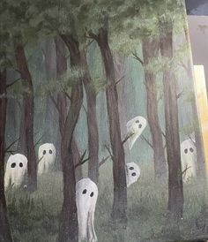 a painting with white ghost faces in the woods