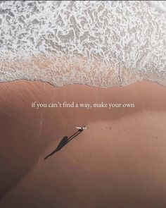 a person walking on the beach with an ocean in the background that says, if you can't find a way, make your own