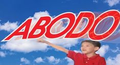 a young boy holding the word above his head in front of a blue sky with clouds