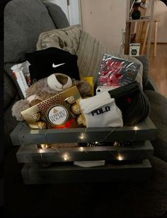 a coffee table with some items on it and lights in front of the top shelf