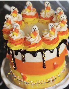 a cake decorated with candy and ghost decorations