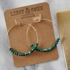 Delicate hoops — choose gold filled or sterling silver — with chunky malachite beads. Equally earthy and ethereal, perfect for every day. 45mm (about 1.75") gold-filled or sterling silver hoops with 3x4mm Malachite beads packaged on a hand-stamped kraft earring card in a clear resealing bag Not sure which gemstone to choose? This blog post might help: Get Your Woo-Woo on with Gemstone Jewelry Malachite Earrings, Earring Card, Gold Filled Hoops, Chunky Beads, Earring Cards, Beaded Hoop Earrings, Beaded Hoops, Sterling Silver Hoops, Silver Hoops