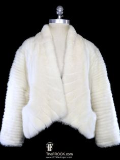 a white fur jacket on a mannequin dummy