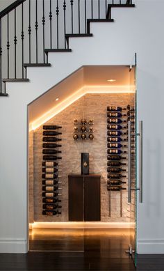 a wine cellar in the middle of a staircase