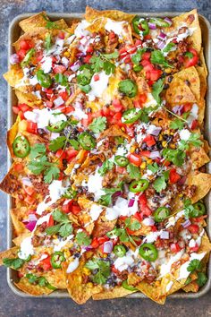 an overhead shot of nachos in a baking dish