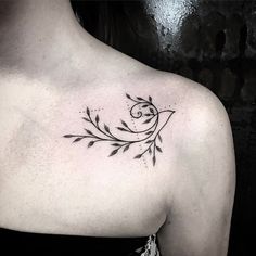 a woman with a tattoo on her shoulder