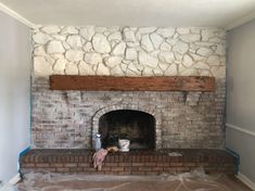 a brick fireplace is being installed in the living room