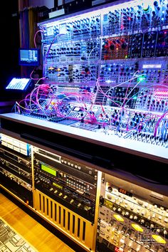 an array of electronic equipment on display in a room