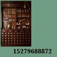 an old fashioned wooden cabinet with many bottles on the top and bottom shelves in front of it