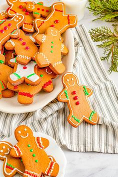 several decorated ginger cookies in a bowl on a table