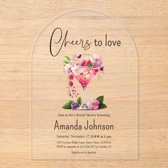 an image of a wooden table with flowers on it and the words cheers to love