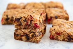 several pieces of fruit and oatmeal bars stacked on top of each other