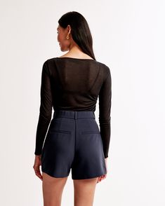 Elevate your wardrobe with the A&F Sloane Tailored Short, a blend of sophistication and comfort. Designed for the modern woman, these shorts offer a chic dark indigo hue that pairs effortlessly with any top.

- Size: 26
- Color: Dark Indigo
- Material: Polyester, Viscose, Elastane
- Gender: Female
- Features: Ultra high rise, figure-flattering pleating, functional fly, pockets, partially elasticated waistband

Crafted from a premium blend of polyester, viscose, and elastane, these shorts ensure Fitted Short Tops For Fall, Fitted Short Length Tops For Work, Fitted Short Tops For Work, Classic Fitted Shorts For Business Casual, Classic Short Length Tops For Spring, Fitted Bermuda Shorts For Business Casual, Elegant Short Length Tops For Work, Fitted Shorts With Short Inseam For Fall, Chic Fitted Shorts For Business Casual