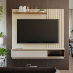 a flat screen tv mounted to the side of a wall